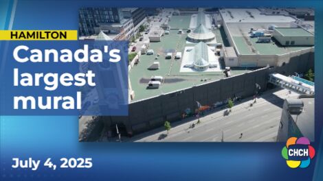 Artists create what could be Canada’s largest mural in downtown Hamilton
